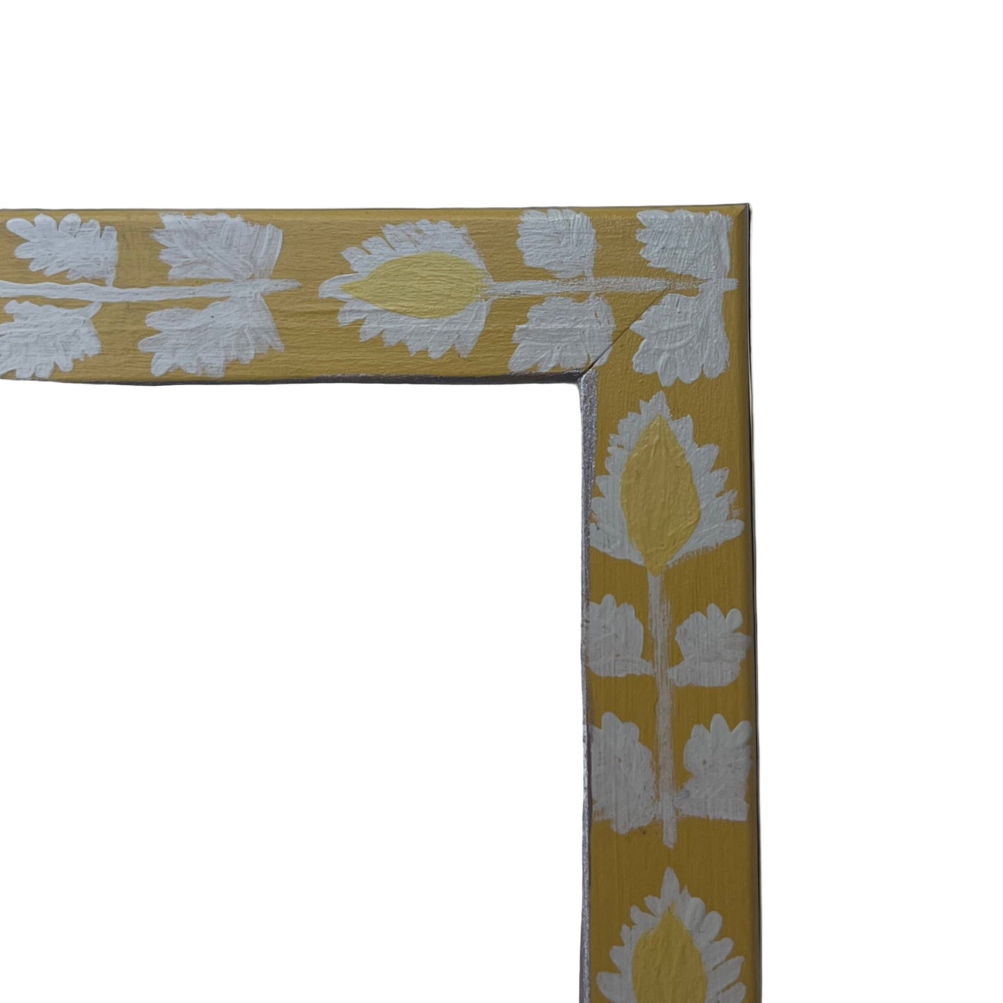 Yellow decorative frame with white floral pattern on a light blue background