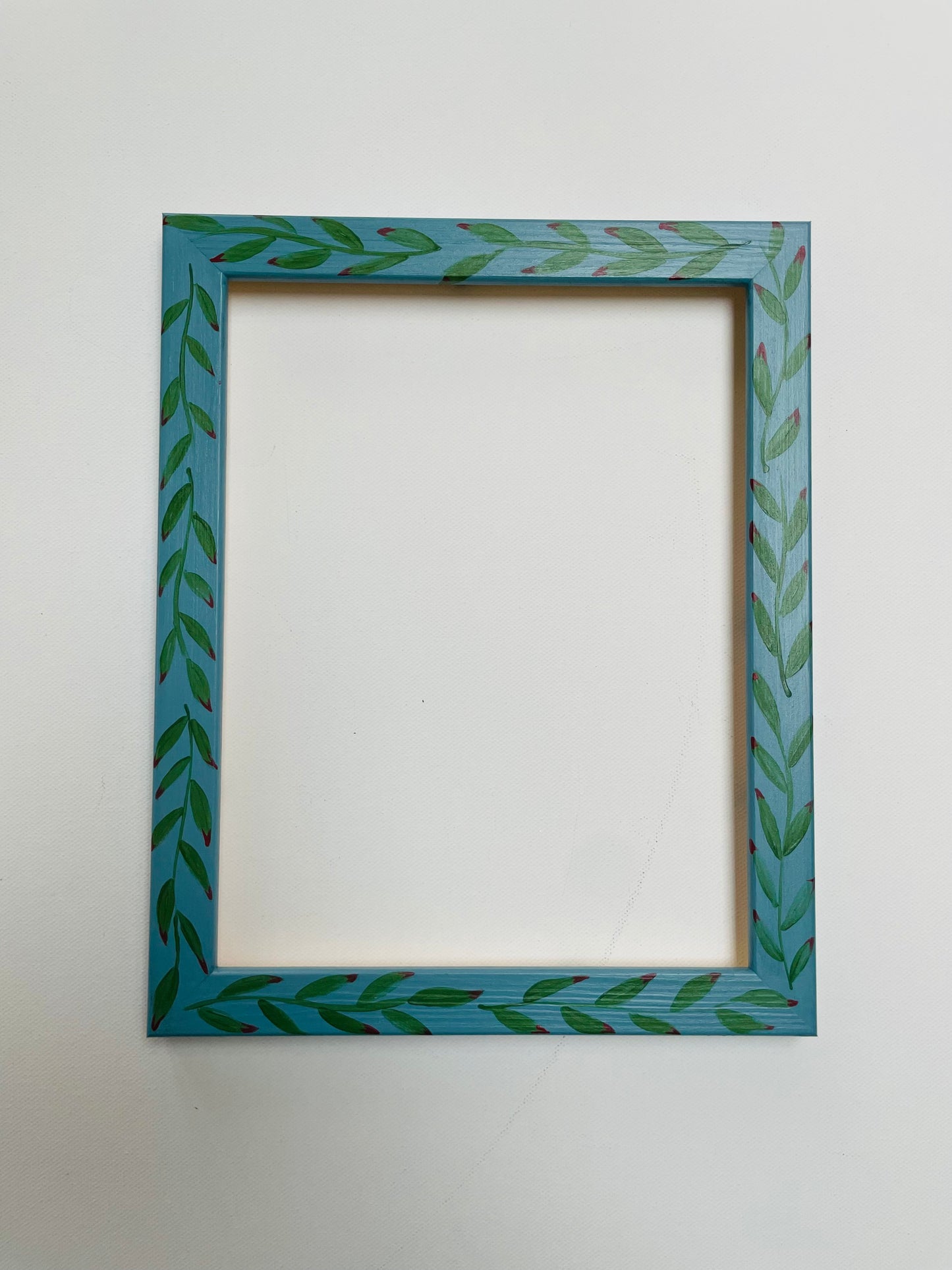 hand-painted frame – green leaves on blue