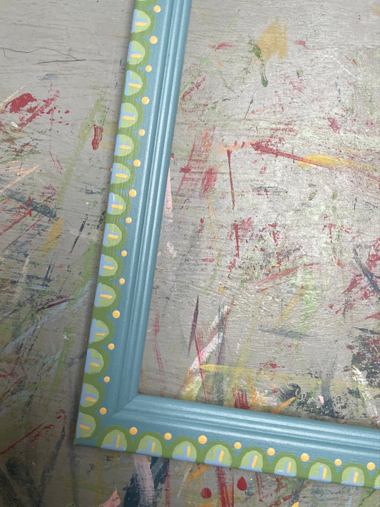 hand-painted frame –  green and yellow scallops on blue